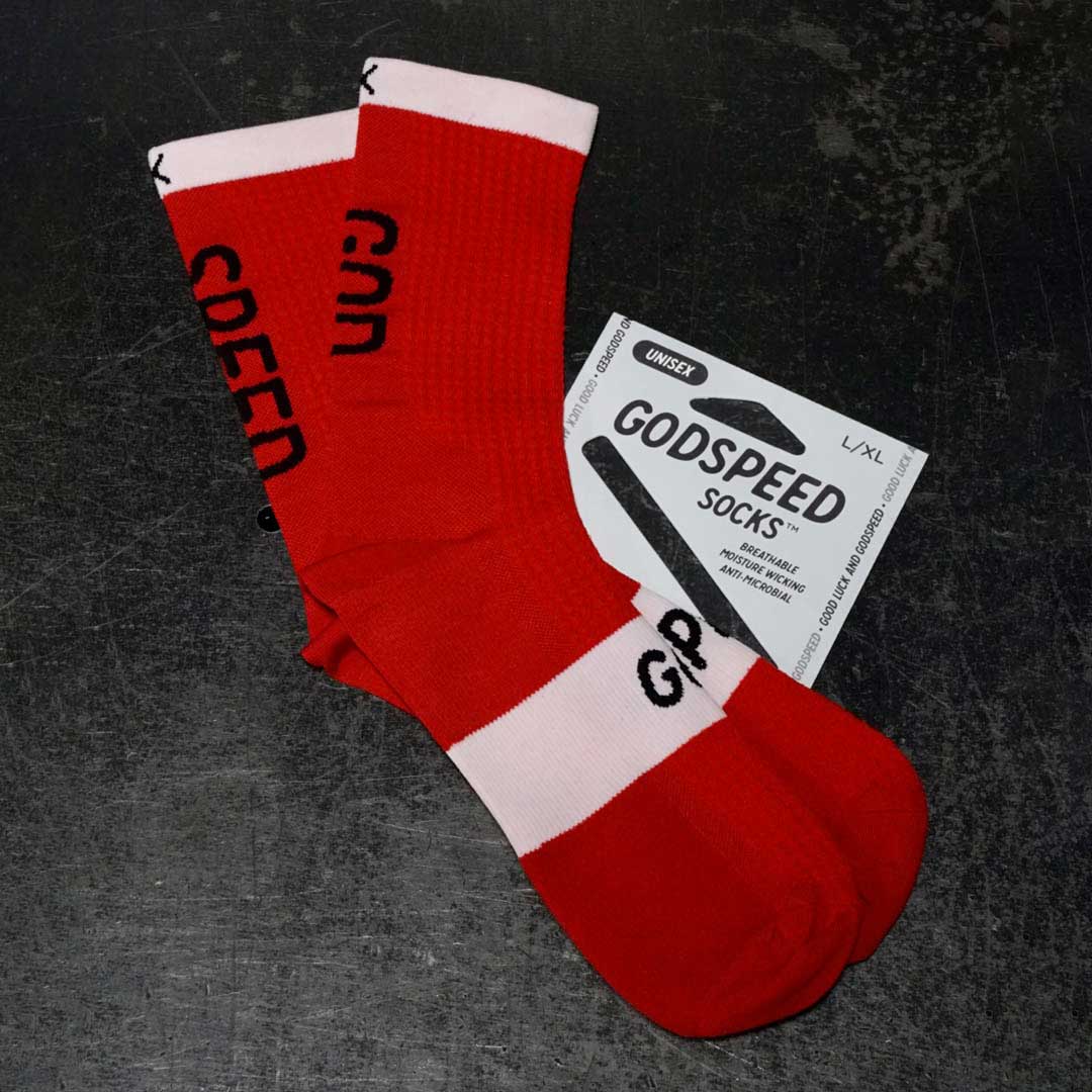 Red and white 'Speed God' athletic socks make running, cycling, and working out better and more comfortable.